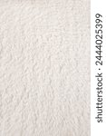 white plush fabric texture background, background pattern of soft warm material