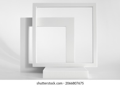 White podium on the white background, simple geometric forms. Podium for product, cosmetic presentation. Creative mock up. Pedestal or platform for beauty products. - Shutterstock ID 2066807675