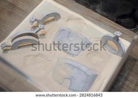 White polyamide powder and object on 3D printed from white polyamide powder close-up. Polyamide powder for creating objects on 3D printer. Additive MJF Multi Jet Fusion technologies. Thermoplastic