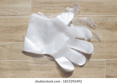 White Polyethylene Gloves Pandemic 2020 Part Of The Left Glove On A Light Background Top View