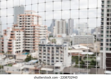 White Polypropylene Mesh Bird Netting With Anti Uv Is Commonly Installed In Apartment And Condominium In Bangkok City, Thailand To Protect Birds.   