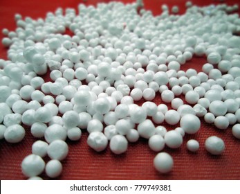 White polystyrene balls on red tablecloth