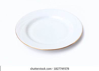 White Porcelain Plate With A Gold Border On A White Background