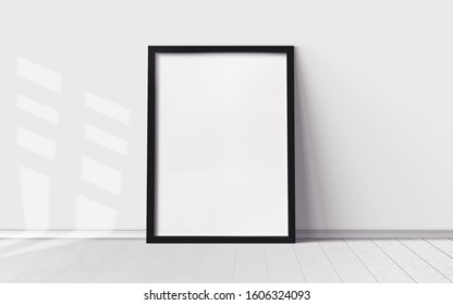 White Poster With Blank Frame On Wooden Floor. Mockup For You Design Print.