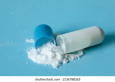 A White Powder, Drug, Or Drug Spilled Out Of The Capsule Shell.