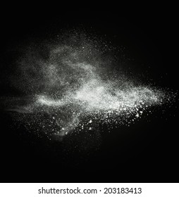 White Powder Exploding Isolated On Black