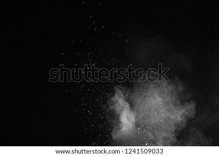   White powder explosion isolated on black background
