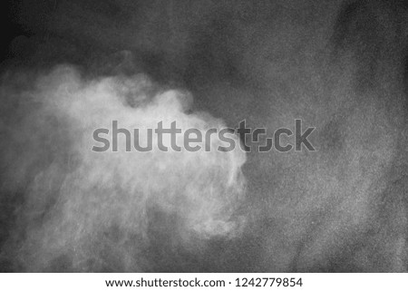  White powder explosion isolated on black background

