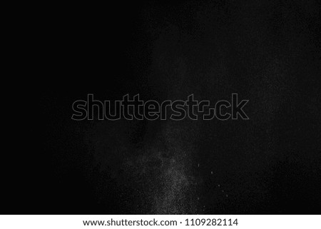 White Powder explosion on black background. White dust exploding.Paint Holi