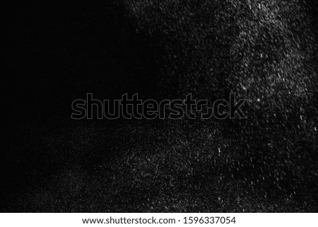 
White powder explosion on black background. 