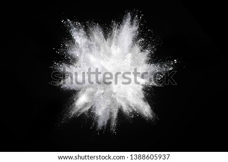 White powder explosion on dark  background. Colored cloud. Colorful dust explode. Paint Holi. 