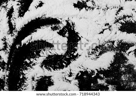 White powder isolated on black background, top view