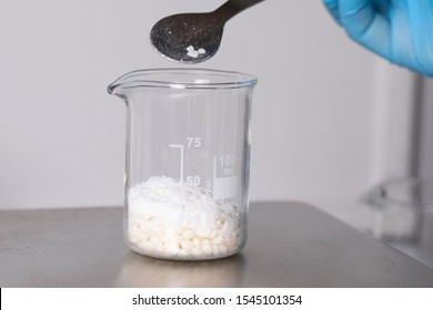 White Powder In Medical Beaker Close Up