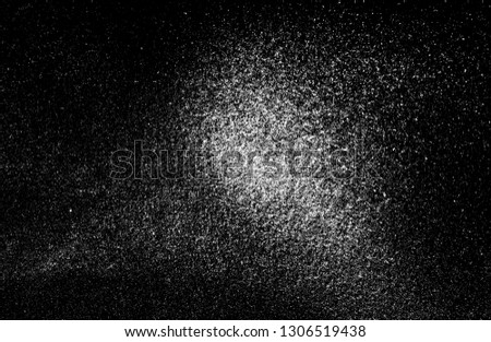 White powder on a black background.
