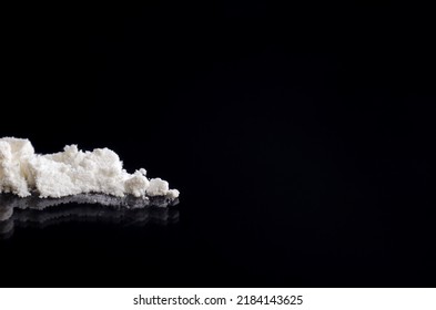 White Powder On A Black Reflective Surface, Close-up