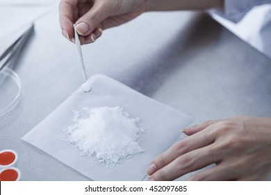 White Powder On Top Of The Paper.