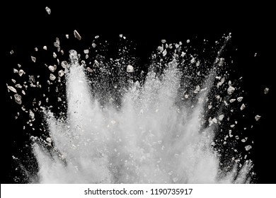 White Powder With Small Stones Explosion On Black Background. Small Granite Rock Stone Splash Against Dark Background.