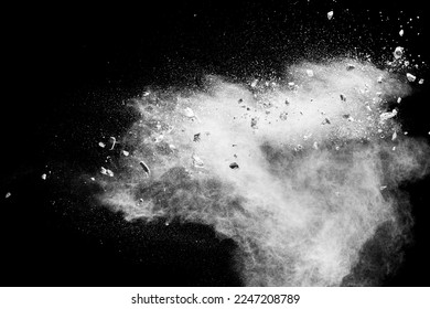 White powder with small stones on black background. Small granite rock stone fly on dust against dark background. - Shutterstock ID 2247208789