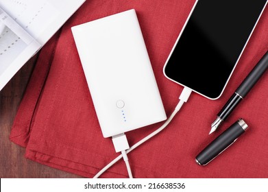 White Power Bank Charging Smart Phone