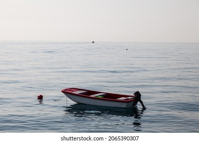 White Power Boat Stops At The Port Small Motor Boat On A Calm Silent Sea Reflections Motorized Boat And Sea At Sunset In Turkey