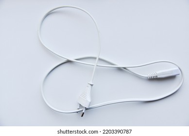 White Power Cord On A White Background. Electric Cord On A White Background.