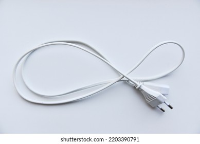 White Power Cord On A White Background. Electric Cord On A White Background.