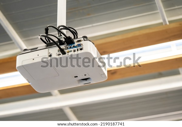White Projector Hang it on the ceiling in the\
middle of the meeting\
room.