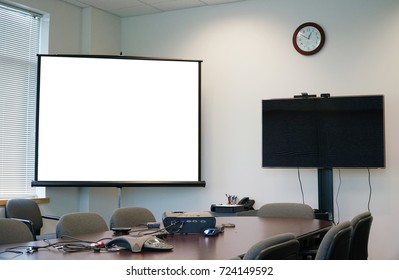 White Projector Screen And Monitor In The Meeting Room