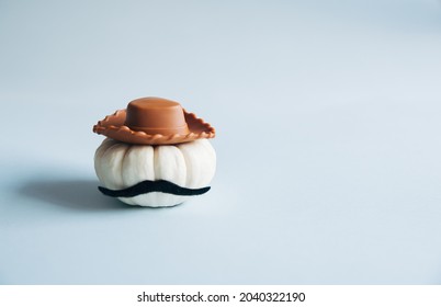 White Pumpkin With Cowboy Hat And Mustache. Autumn Minimal Style.