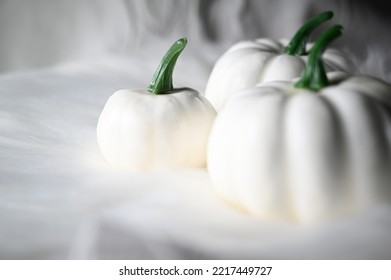 White Pumpkin Table Decoration On White Background, Selective Focus