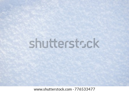 White pure snow texture, background of fresh snow texture in blue tone, rough snowy surface