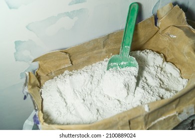 White Putty In An Open Paper Bag. Finishing Dry Powder For Leveling Walls And Ceilings. Repair In The House With Your Own Hands. DIY. Selective Focus