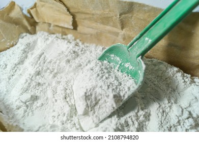 White Putty In An Open Paper Bag. Finishing Dry Powder For Leveling Walls And Ceilings. Repair In The House With Your Own Hands. DIY. Selective Focus