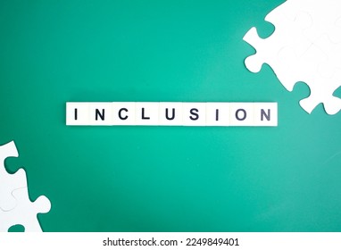 white puzzle with the word Inclusion - Shutterstock ID 2249849401