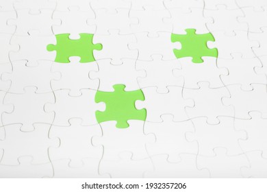 White puzzles with missing pieces inside. Riddle and simple solution for business