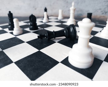 white queen defeat the black king side view of chess board - Powered by Shutterstock