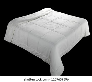 White Quilt Laid Down On A Double Bed Shape. Isolated On Black Background
