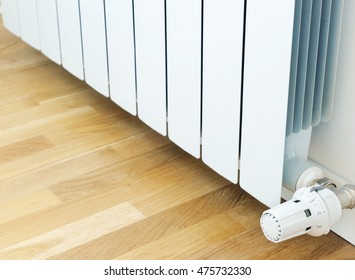 White radiator in an apartment. Radiator. - Shutterstock ID 475732330