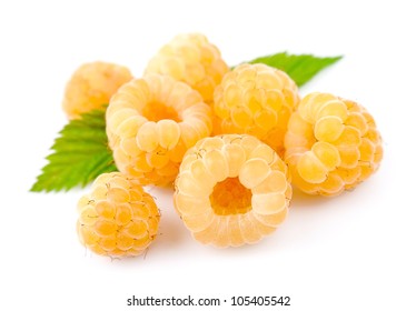 White raspberry fruits with leafs on white background