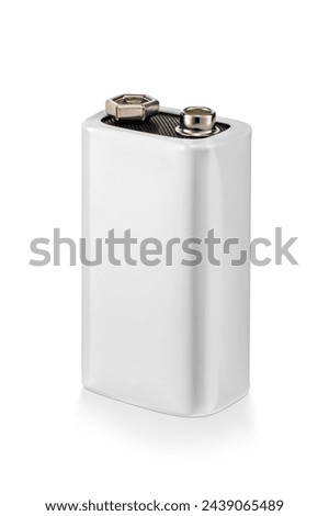 White rectangular 9-volt battery isolated on a clean white background. Positive and negative terminals are visible.