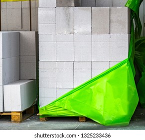 White Rectangular Bricks, Including Decorative Brick On An Outdoor Pallet.