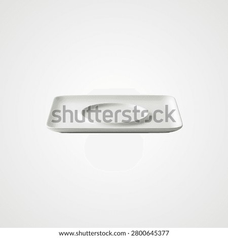 White rectangular ceramic saucer with circular indentation for cup
