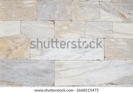 White rectangular marble stone wall texture, natural masonry background, marble tile surface, limestone cladding, decorative stone wall, horizontal stone blocks, rough stone surface, building facade.