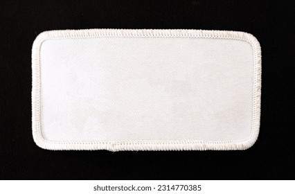 White rectangular patch with white trim and rounded corners.