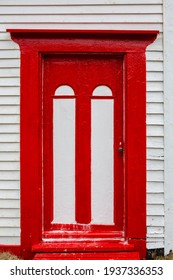 White And Red Door In An Old Clapboard House.