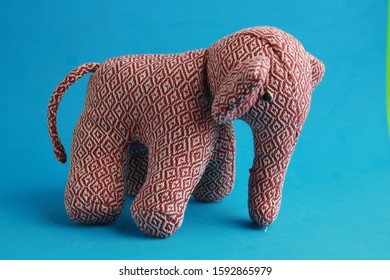 White and red elephant-shaped rag doll