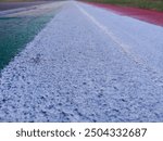 White red and green curb at the Imola racetrack where racing and formula one cars pass
