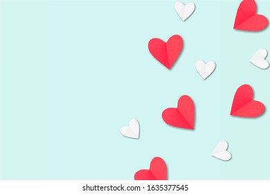 White and red paper hearts on pastel blue background. - Shutterstock ID 1635377545