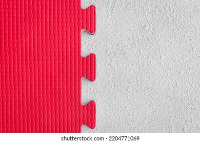 White And Red Puzzle Rubber Mat Pattern Gym Floor Background Abstract Design.