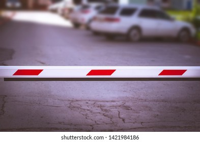 White And Red Security Boom Barrier Gate At The Car Parking Lot For Access Control. Border Control Point. Trade War, Tariffs Concept.